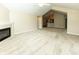Bright and airy living space with a fireplace and an open layout flowing into the kitchen area at 16628 Brownstone Ct, Westfield, IN 46074
