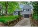 Charming two-story home featuring a landscaped yard and inviting curb appeal with a garage and well-maintained lawn at 1717 W 10Th St, Anderson, IN 46016