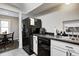 Practical kitchen with ample counter space, efficient appliances, and a view into the dining area, making meal prep convenient at 1717 W 10Th St, Anderson, IN 46016