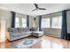 Bright living room with large windows, a cozy sectional sofa, and neutral decor at 1717 W 10Th St, Anderson, IN 46016