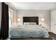 Spacious main bedroom featuring a cozy bed, neutral colors, and bedside lamps at 1717 W 10Th St, Anderson, IN 46016