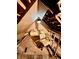 Unfinished attic area featuring a small window and wooden beams at 1806 Union St, Columbus, IN 47201