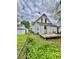 Exterior image featuring a cozy wooden deck and a white house, surrounded by green ivy at 1806 Union St, Columbus, IN 47201