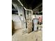 View of the basement with furnace and hot water tank at 1806 Union St, Columbus, IN 47201