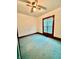 A bright bedroom with a ceiling fan and large window provides natural light and ventilation at 1806 Union St, Columbus, IN 47201