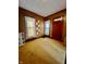 A spacious room with neutral tones, two windows, original trim, and classic, vintage details at 1806 Union St, Columbus, IN 47201