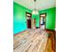 Dining area featuring hardwood floors, contemporary lighting, and convenient access to other rooms at 1806 Union St, Columbus, IN 47201
