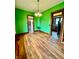 Dining area featuring hardwood floors, contemporary lighting, and a smooth transition to adjacent rooms at 1806 Union St, Columbus, IN 47201