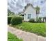 Traditional-style home with vinyl siding, green lawn, and mature landscaping, offering great curb appeal at 1806 Union St, Columbus, IN 47201