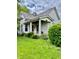 Charming two-story home with a covered front porch, mature landscaping, and traditional architectural details at 1806 Union St, Columbus, IN 47201