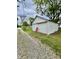Detached garage with a gravel driveway and adjacent yard at 1806 Union St, Columbus, IN 47201