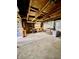 Unfinished garage space with exposed wooden beams and ample potential at 1806 Union St, Columbus, IN 47201