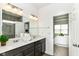 Bathroom featuring double sinks, quartz countertop and stylish mirror at 1829 James Pierce Dr, Shelbyville, IN 46176