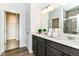 Bathroom with dual sinks, modern cabinets, and a shower at 1829 James Pierce Dr, Shelbyville, IN 46176