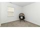 Inviting bedroom showcasing neutral carpet, a window with blinds, and a papasan chair at 1829 James Pierce Dr, Shelbyville, IN 46176