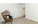 Warm bedroom showcasing neutral carpet, white walls, and a comfortable papasan chair at 1829 James Pierce Dr, Shelbyville, IN 46176