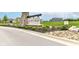 A welcoming stone 'Bear Run' community sign framed by lush landscaping and situated in a vibrant, well-maintained neighborhood at 1829 James Pierce Dr, Shelbyville, IN 46176