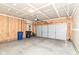 Spacious two-car garage featuring concrete floors, bare drywall, and an insulated garage door at 1829 James Pierce Dr, Shelbyville, IN 46176