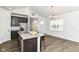 Open-concept space with a modern kitchen, complete with stainless steel appliances and a kitchen island at 1829 James Pierce Dr, Shelbyville, IN 46176