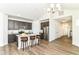 Modern kitchen features dark cabinets, stainless steel appliances, and a granite countertop island with seating at 1829 James Pierce Dr, Shelbyville, IN 46176