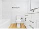 Clean, remodeled bathroom with white subway tile, modern vanity, and updated fixtures at 225 S Carthage Rd, Charlottesville, IN 46117