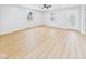 Open-concept living room boasting light flooring, neutral walls, and natural light at 225 S Carthage Rd, Charlottesville, IN 46117