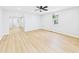 Spacious living room with light flooring, neutral walls, and a ceiling fan at 225 S Carthage Rd, Charlottesville, IN 46117