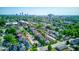 Aerial showcasing townhomes amidst tree-lined neighborhood with a beautiful city skyline at 2260 Central Ave, Indianapolis, IN 46205