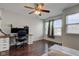 Bedroom with hardwood floors, a ceiling fan, and a comfortable space with bright window views at 2260 Central Ave, Indianapolis, IN 46205
