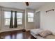 Bright bedroom featuring hardwood floors, natural light through windows, and neutral-toned walls at 2260 Central Ave, Indianapolis, IN 46205