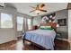 Bedroom with wood floors, a ceiling fan, a bed, and access to a balcony at 2260 Central Ave, Indianapolis, IN 46205