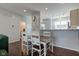 Cozy dining area with a wooden table and white chairs, offering a welcoming space for meals and gatherings at 2260 Central Ave, Indianapolis, IN 46205