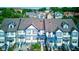 Charming townhouse featuring a cream and blue exterior and inviting front patios and balconies at 2260 Central Ave, Indianapolis, IN 46205