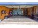 Inside view of an empty garage with concrete flooring, exposed framing, and shelving for storage at 2260 Central Ave, Indianapolis, IN 46205