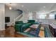 Inviting living room with open concept, hardwood floors, and a comfortable sofa, leading into the kitchen at 2260 Central Ave, Indianapolis, IN 46205