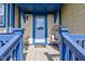 Inviting front porch with blue railings, comfortable seating, and a welcoming entrance at 2260 Central Ave, Indianapolis, IN 46205