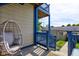 Relax on this home's porch featuring a stylish wicker chair and comfortable seating at 2260 Central Ave, Indianapolis, IN 46205