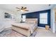 Comfortable bedroom featuring a plush bed, accent wall, ceiling fan, and natural light at 3016 Gibbert Ln, Westfield, IN 46074