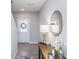 Inviting entryway featuring a decorative table with a golden lamp and round mirror at 3016 Gibbert Ln, Westfield, IN 46074
