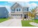 Charming two-story home featuring a well-maintained lawn and an attached two-car garage at 3016 Gibbert Ln, Westfield, IN 46074