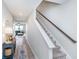 Hallway with staircase leading up, with view of living room and blue couch at 3016 Gibbert Ln, Westfield, IN 46074
