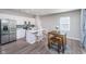 Bright kitchen features white cabinetry, stainless steel appliances, and eat-in island at 3016 Gibbert Ln, Westfield, IN 46074