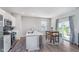 Modern kitchen area featuring a kitchen island with seating, and table with seating at 3016 Gibbert Ln, Westfield, IN 46074