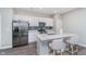Bright kitchen features white cabinetry, stainless steel appliances, and eat-in island at 3016 Gibbert Ln, Westfield, IN 46074