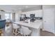 Bright kitchen features white cabinetry, stainless steel appliances, and eat-in island at 3016 Gibbert Ln, Westfield, IN 46074