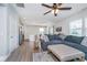 Open-concept living room with a comfortable sofa, connecting to the kitchen area at 3016 Gibbert Ln, Westfield, IN 46074