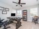 Home office with natural light features neutral walls and a dark wood desk at 3016 Gibbert Ln, Westfield, IN 46074