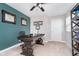 This home office boasts natural light, neutral walls, and a dark wood desk at 3016 Gibbert Ln, Westfield, IN 46074