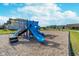 Blue playground with swingsets and slide is nestled in mulch and green grass at 3016 Gibbert Ln, Westfield, IN 46074