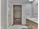 Bathroom showcasing vanity and walk-in shower with floral wall paper at 31 N Restin Rd, Greenwood, IN 46142